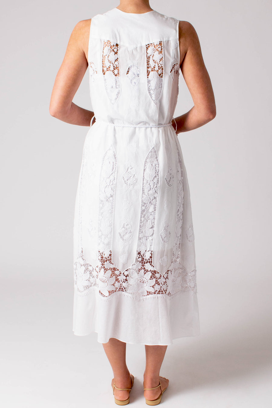 This photo shows the back of the dress. It has lace cut outs and small lace details.